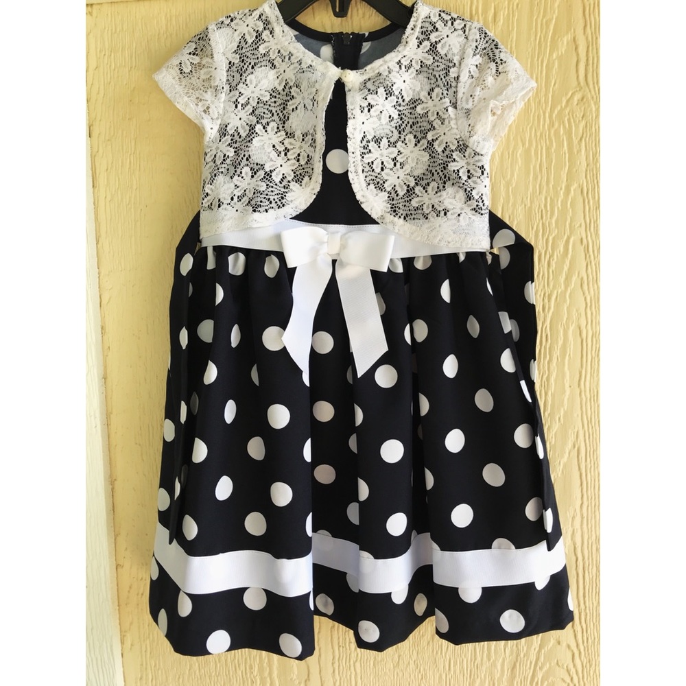 Navy blue and white polka dot little girl’s dress